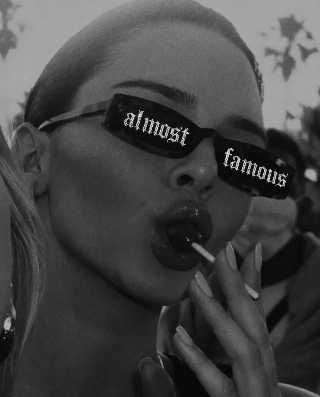 Black and white portrait of a guest wearing Almost Famous sunglasses